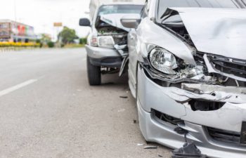 Modern car accident involving two cars on the road