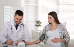 A pregnant woman during doctor's appointment.